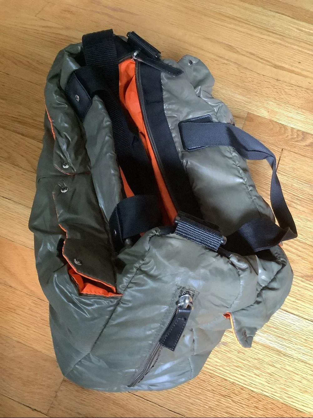 Quilted Olive Green Babymel infant carry all essentials bag with Orange Trim